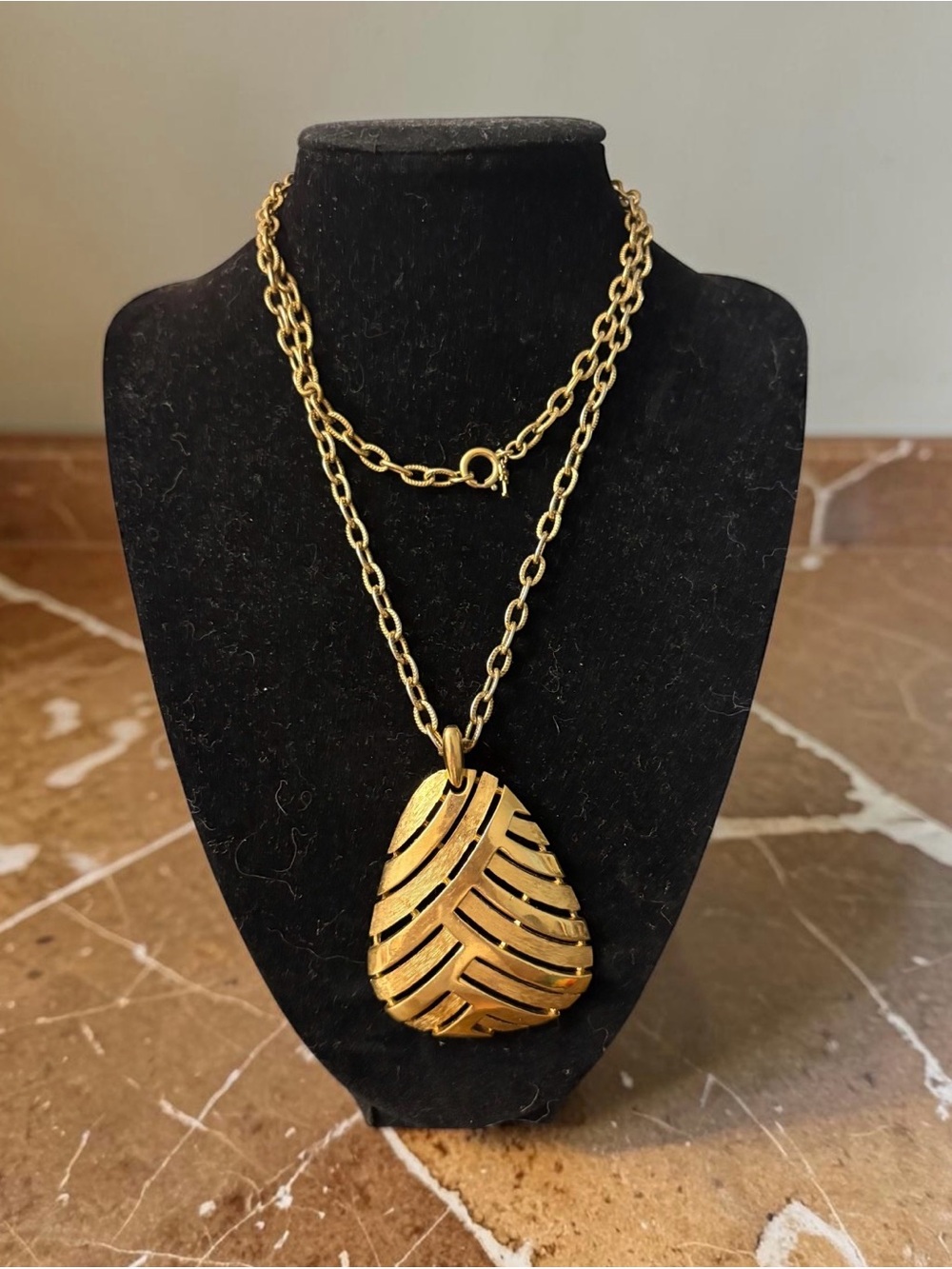 Signed crown trifari pendant necklace with textured metal design